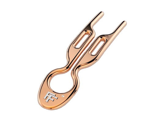 No.1 Hairpin by Fiona Franchimon in solid rose gold. With the FF logo in silver and a diamond next to it.
